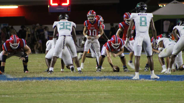 Pace quarterback Nick Simmons (10) studies the Choctawhatchee defense, pre-snap, during his team's 41-17 win in its 2023 season-opener.